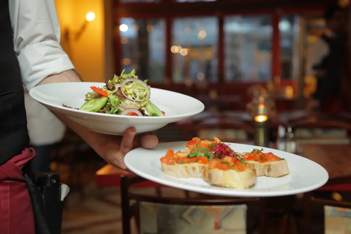 Warm restaurant exterior — reservation ad